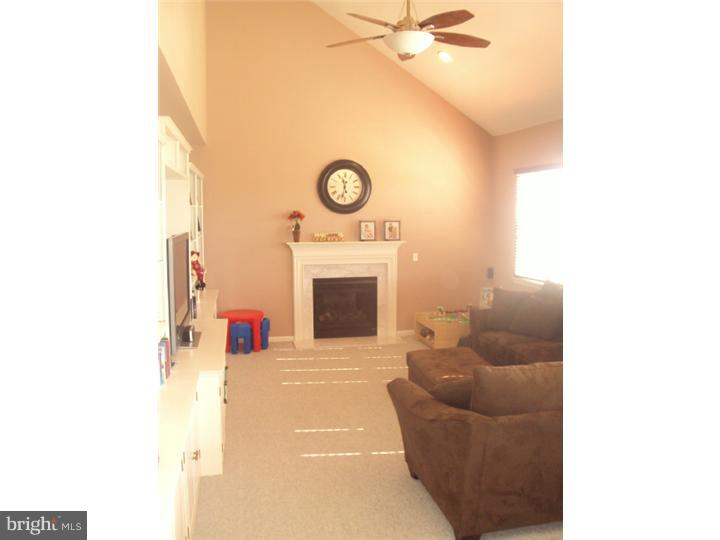 706 Farmhouse Road Mickleton, NJ 08056 - Photo 3 of 24 a living room with furniture and a fireplace
