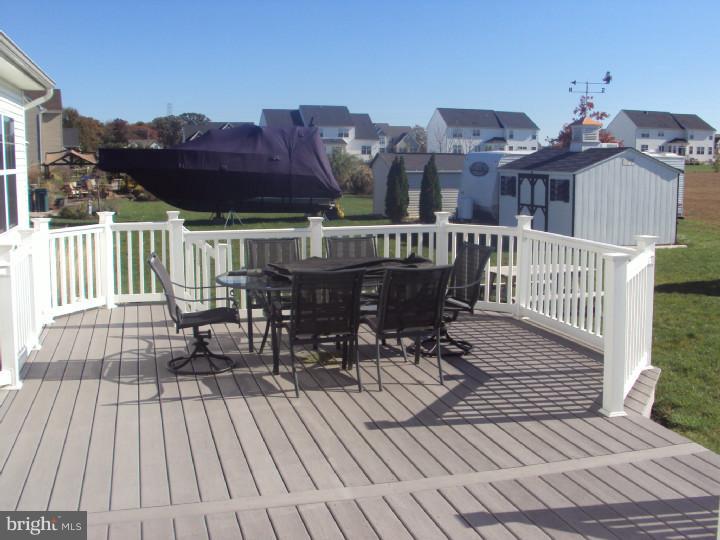 706 Farmhouse Road Mickleton, NJ 08056 - Photo 21 of 24 a view of a brick deck with furniture