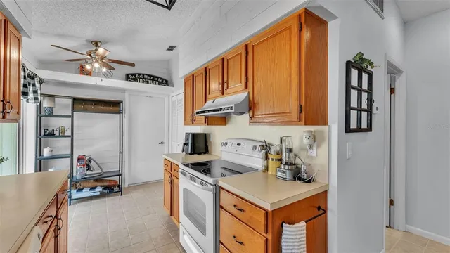 a kitchen that has a lot of cabinets in it
