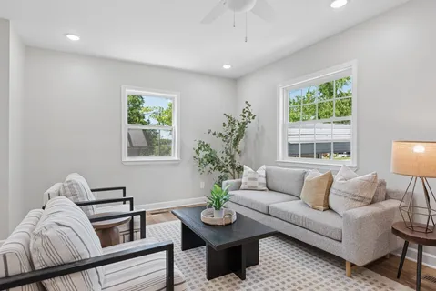 a living room with furniture and a large window