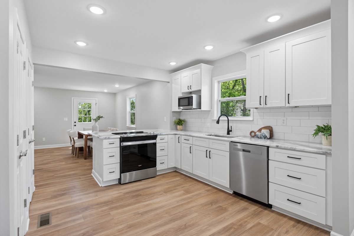 112 Wiley Street Madison, TN 37115 - Photo 13 of 36 a kitchen with a white cabinets and counter top space