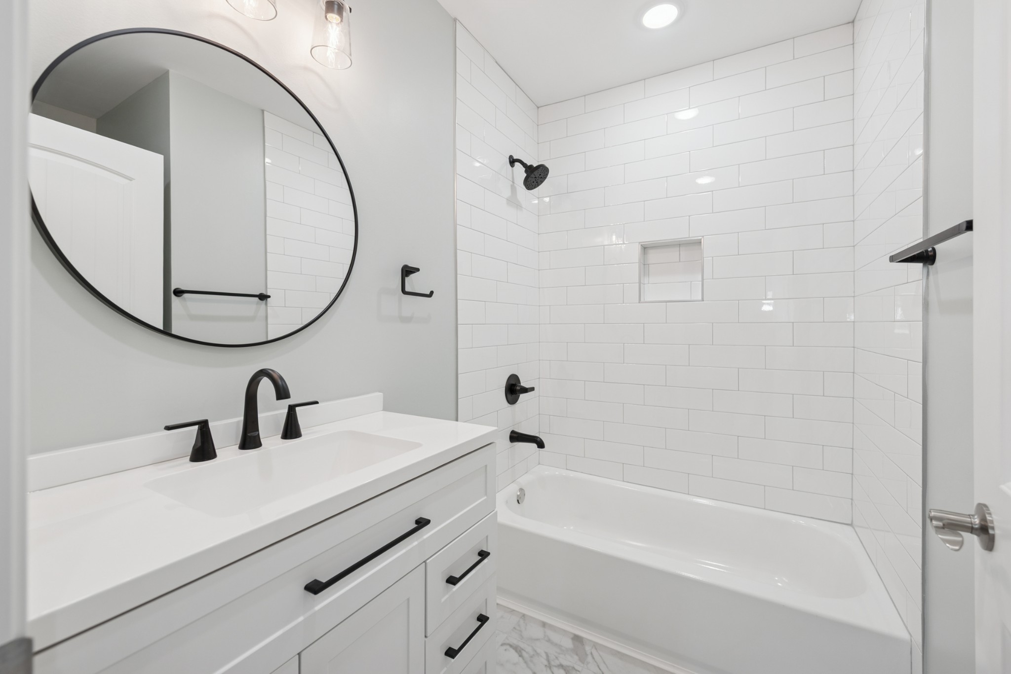 112 Wiley Street Madison, TN 37115 - Photo 21 of 36 a bathroom with a sink a toilet and a mirror