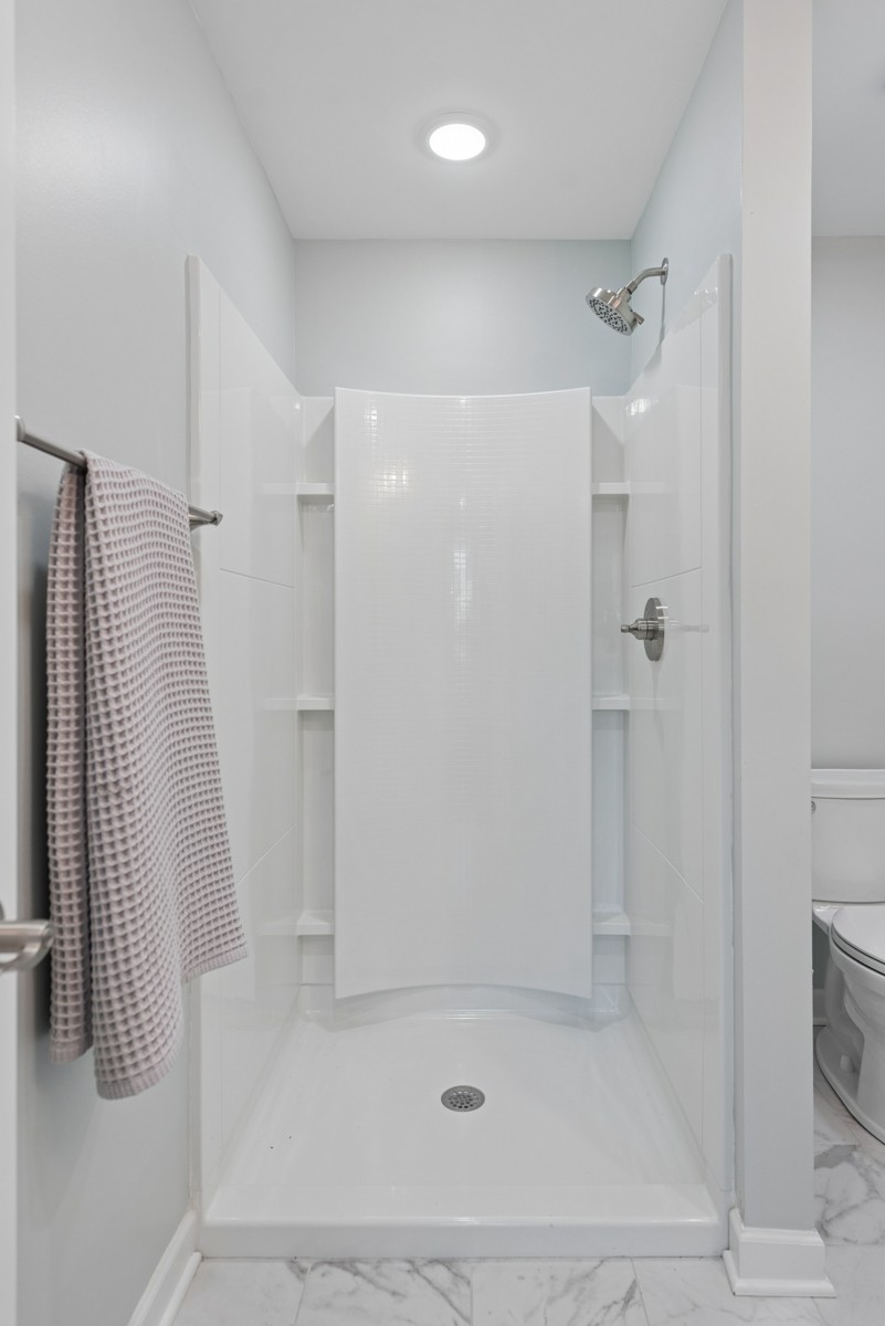 112 Wiley Street Madison, TN 37115 - Photo 30 of 36 a bathroom with a shower and a glass door