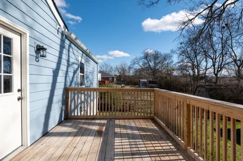 a view of balcony with wooden floor