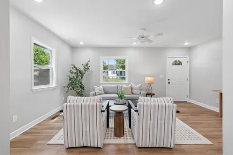a living room with furniture and a window