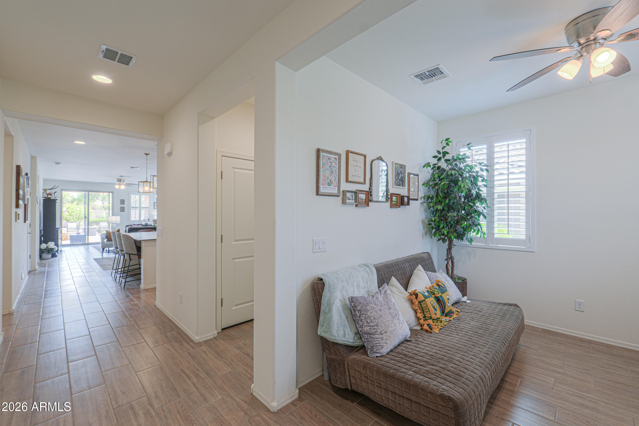 42085 West Cribbage Road Maricopa, AZ 85138 - Photo 3 of 35 a living room with furniture and a wooden floor
