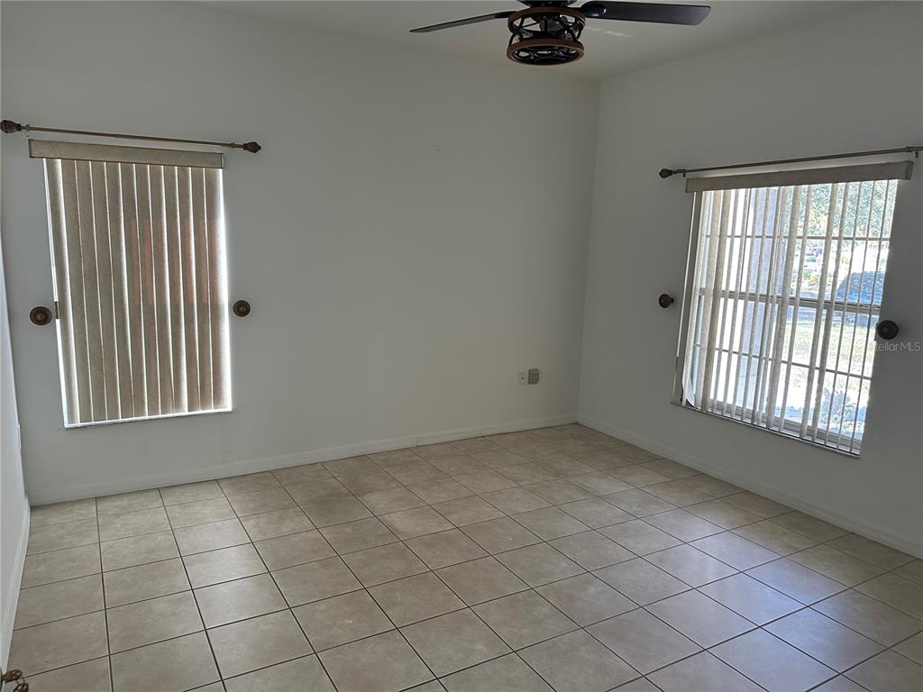 4150 Vanern Way Kissimmee, FL 34746 - Photo 13 of 51 a view of an empty room with a window