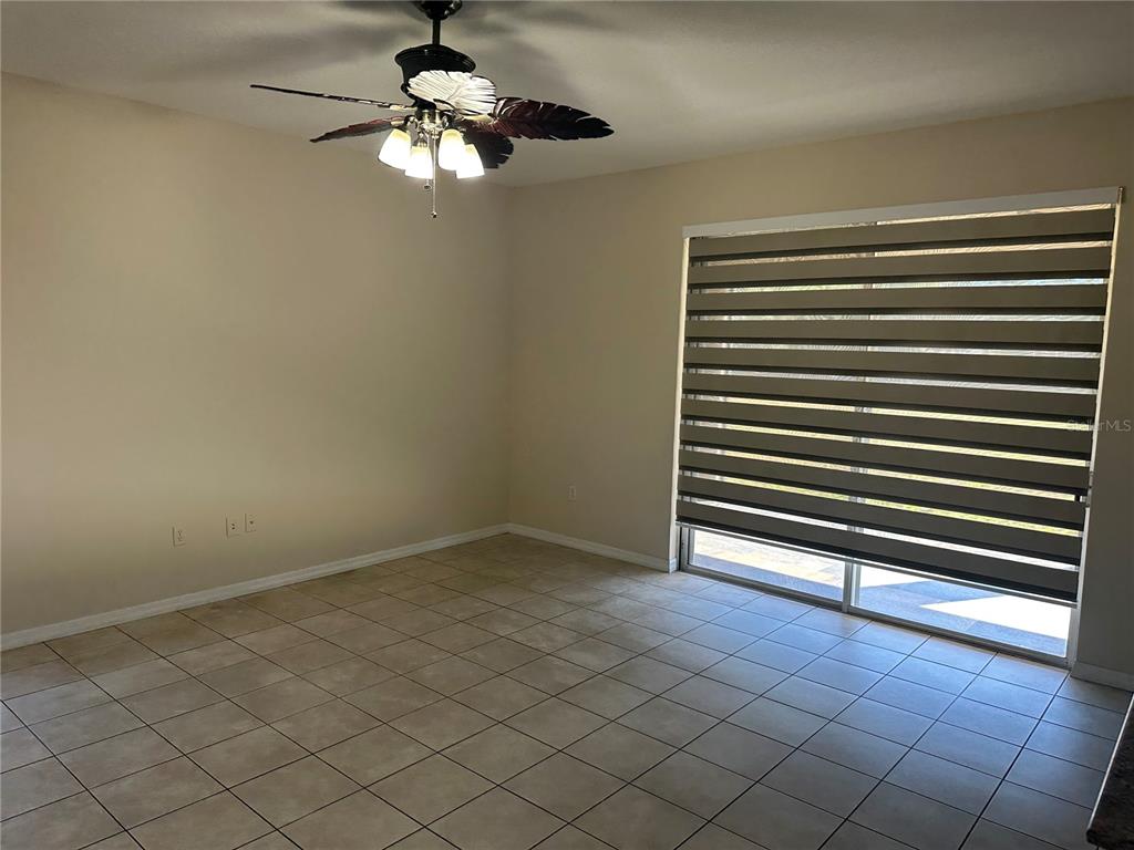 4150 Vanern Way Kissimmee, FL 34746 - Photo 14 of 51 a view of empty room with wooden floor