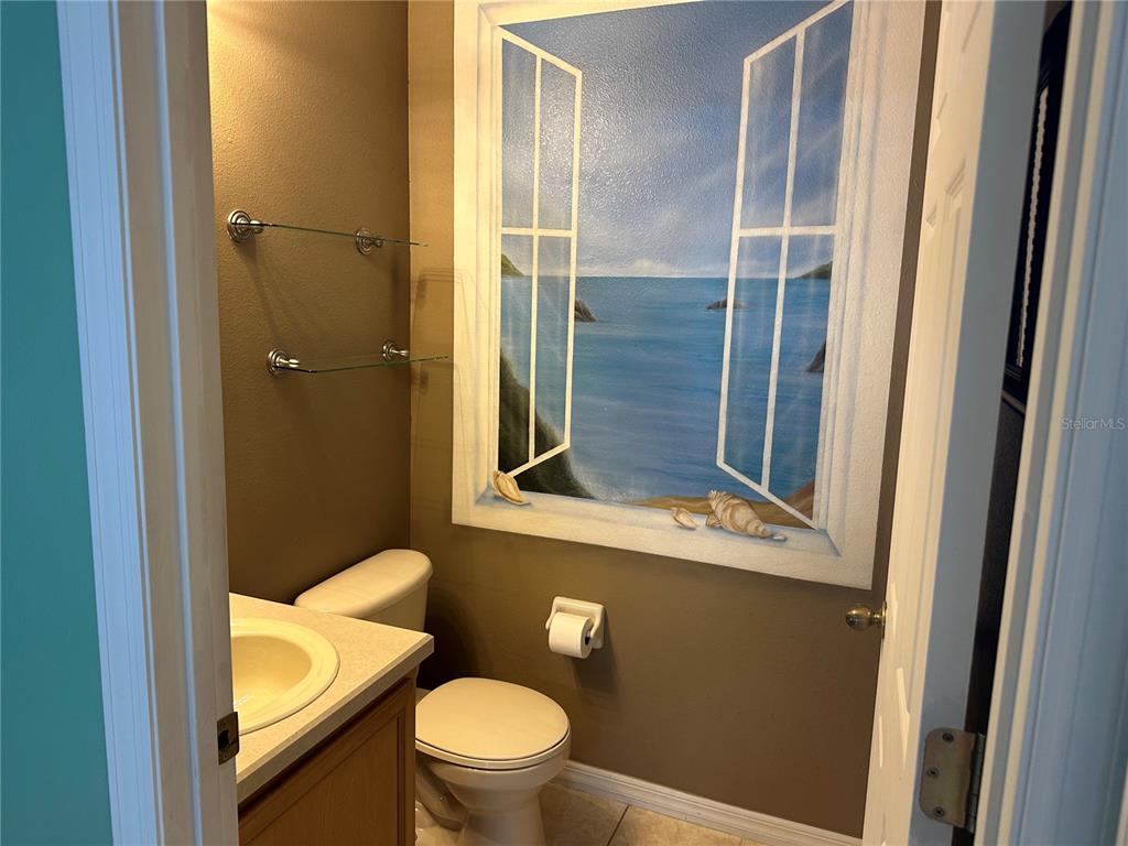 4150 Vanern Way Kissimmee, FL 34746 - Photo 18 of 51 a bathroom with a toilet