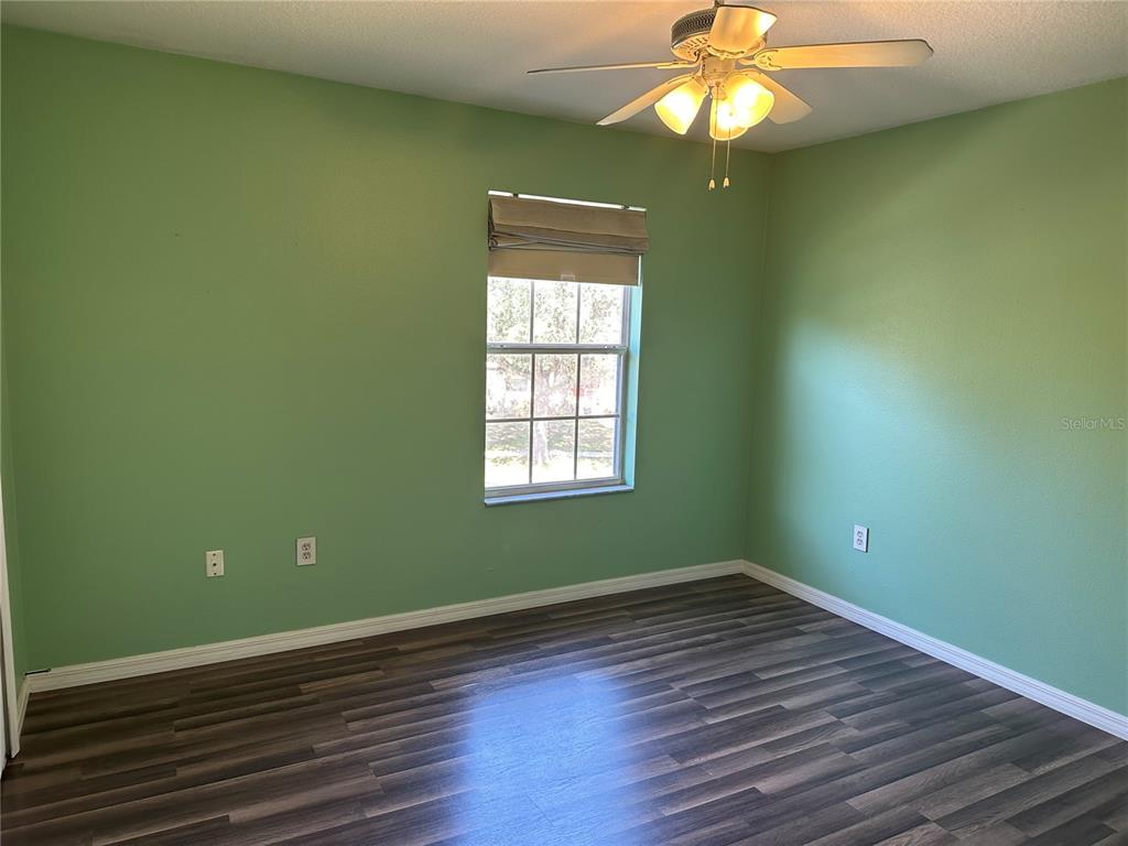 4150 Vanern Way Kissimmee, FL 34746 - Photo 27 of 51 a view of a room with wooden floor and fan