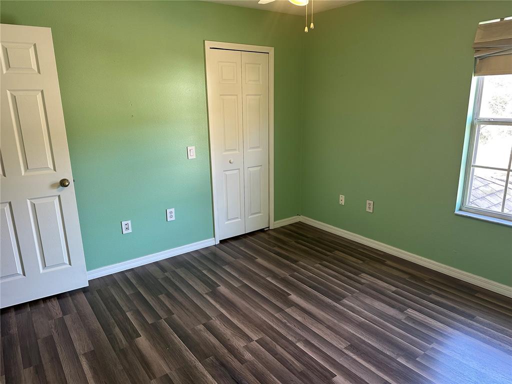 4150 Vanern Way Kissimmee, FL 34746 - Photo 28 of 51 a view of a room with wooden floor and windows