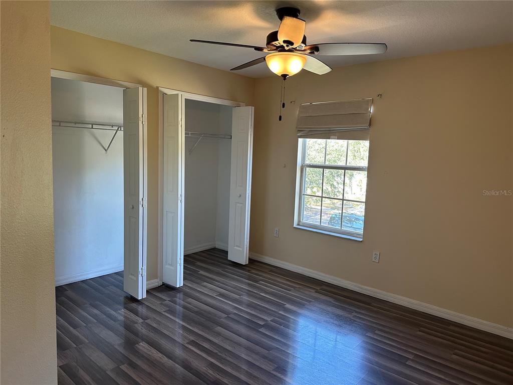 4150 Vanern Way Kissimmee, FL 34746 - Photo 30 of 51 a view of an empty room with wooden floor and a window