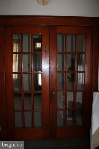 a bedroom with bed and a chandelier