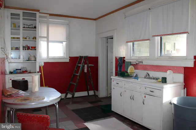 a room with a bed and a mirror