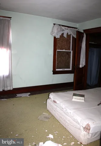 a view of an empty room and window