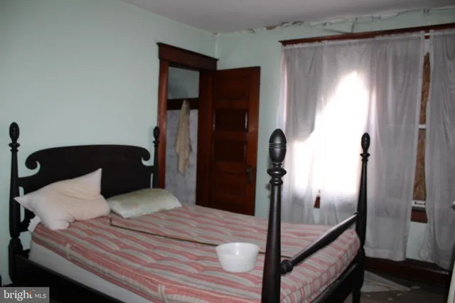 a bathroom with a toilet sink and window