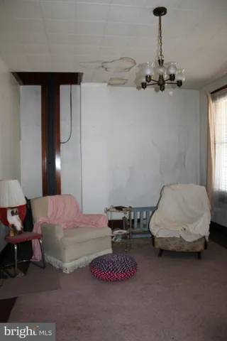 a bedroom with furniture and a chandelier