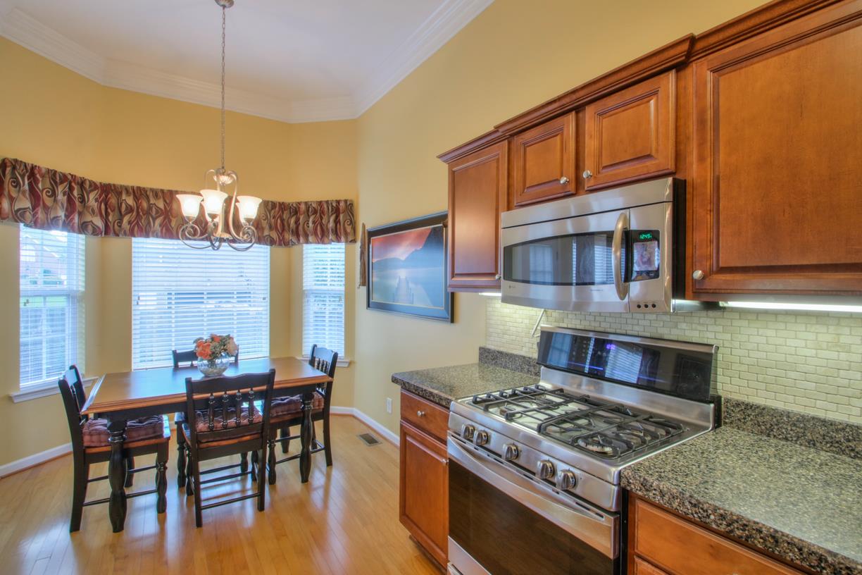 1013 Rhett Place Lebanon, TN 37087 - Photo 8 of 23 Gas stove and tile backsplash. Kitchen eating with bay window.