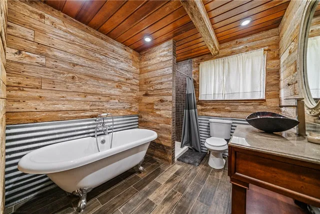 a bathroom with a sink a toilet and bathtub