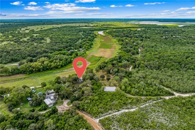 a view of a lake with a yard