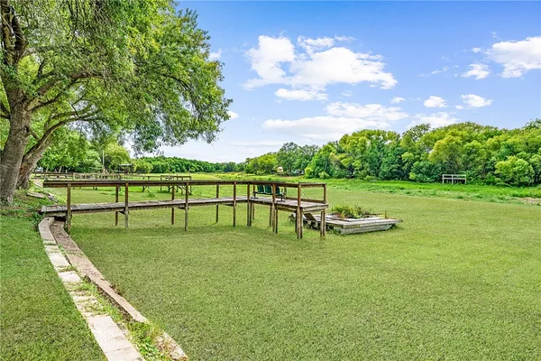 a view of a golf course with chairs