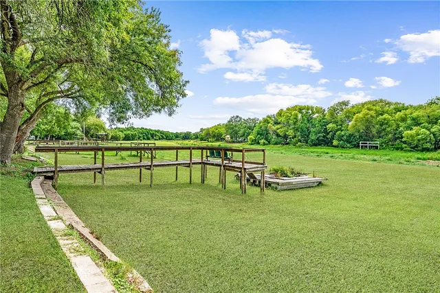 a view of a golf course with chairs