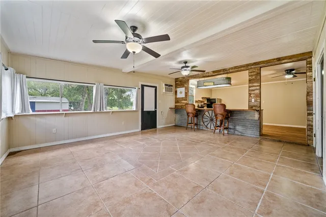 a view of a livingroom with furniture and a window