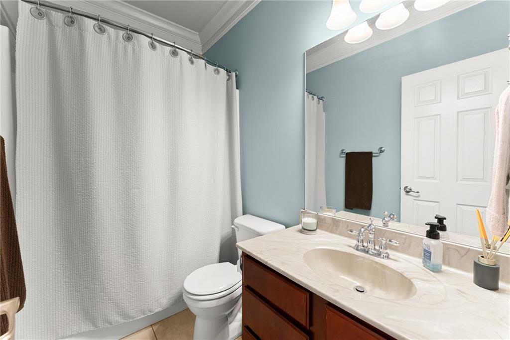6643 Windvane Point Clermont, GA 30527 - Photo 36 of 88 a bathroom with a sink and a mirror