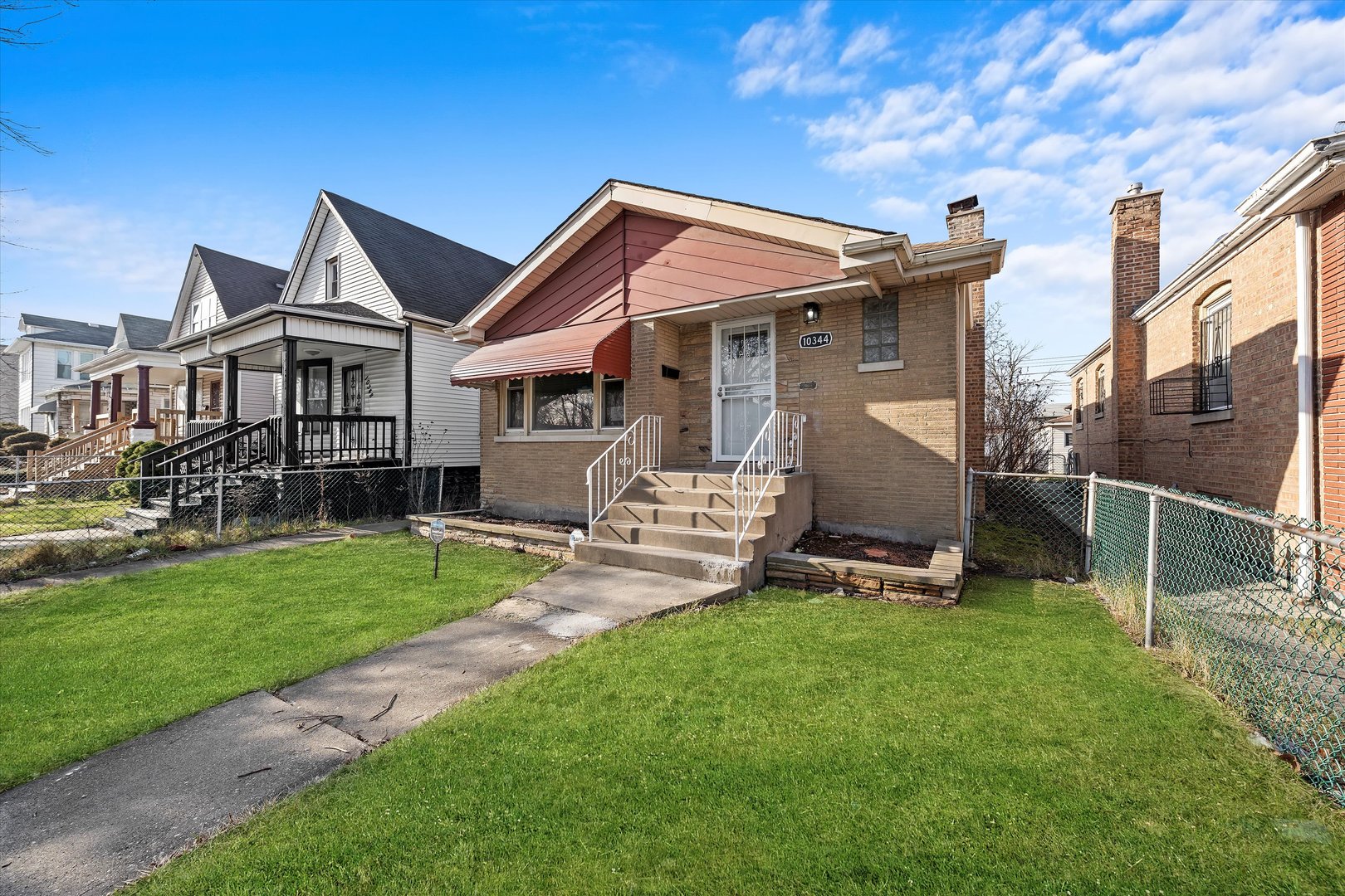 10344 South State Street Chicago, IL 60628 - Photo 1 of 30 a view of a house with backyard and porch