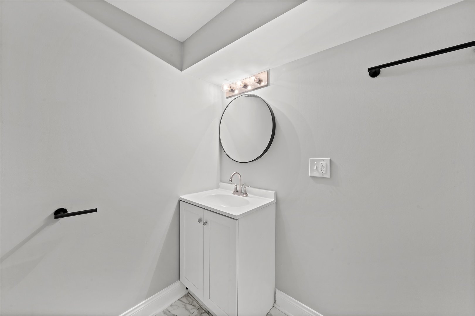 10344 South State Street Chicago, IL 60628 - Photo 14 of 30 a bathroom with a sink and a mirror