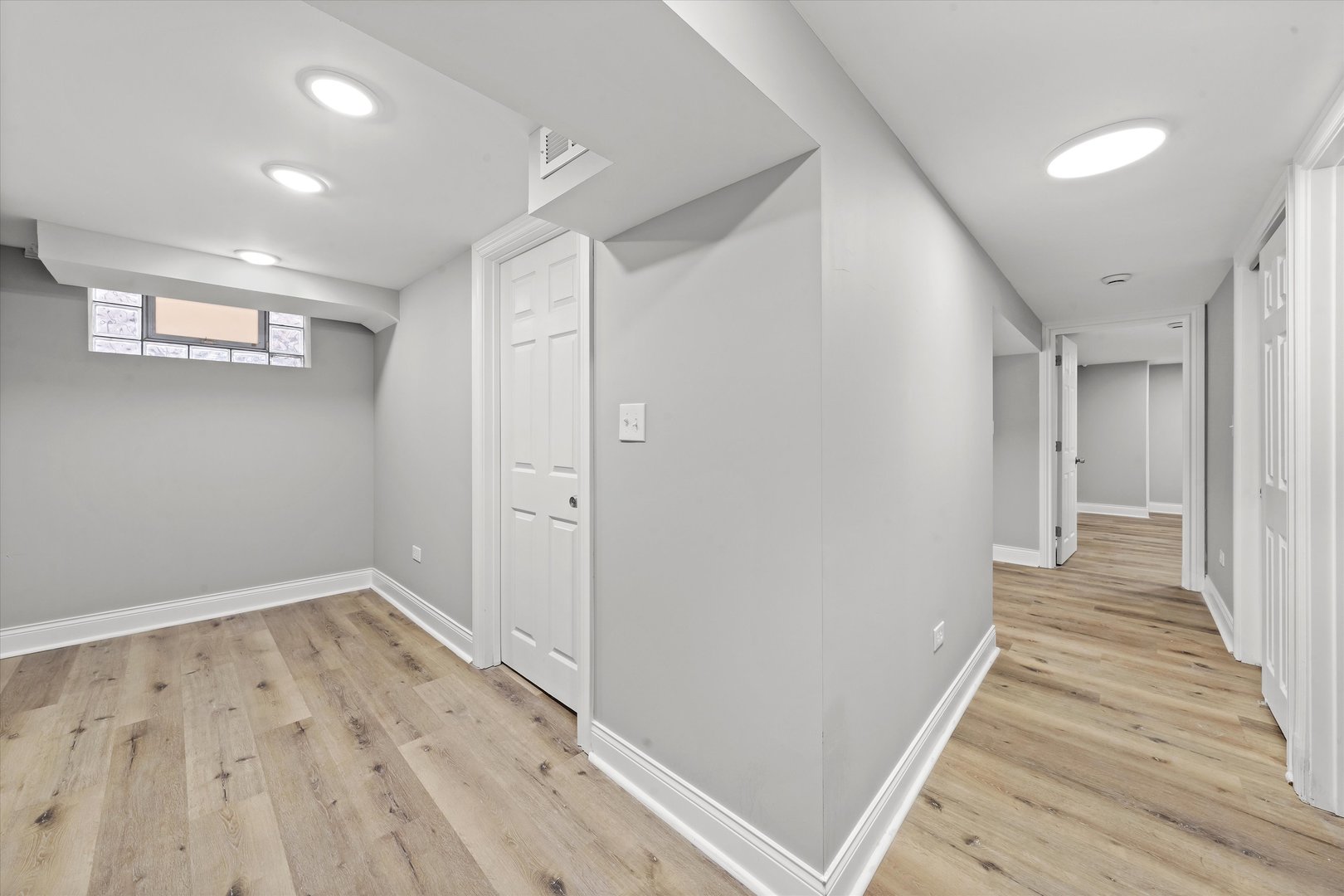 10344 South State Street Chicago, IL 60628 - Photo 16 of 30 a view of a hallway with wooden floor