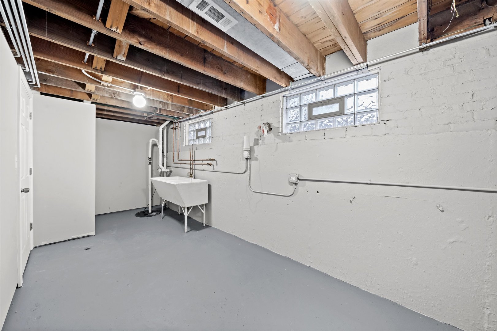 10344 South State Street Chicago, IL 60628 - Photo 18 of 30 a view of a room with racks on the wall