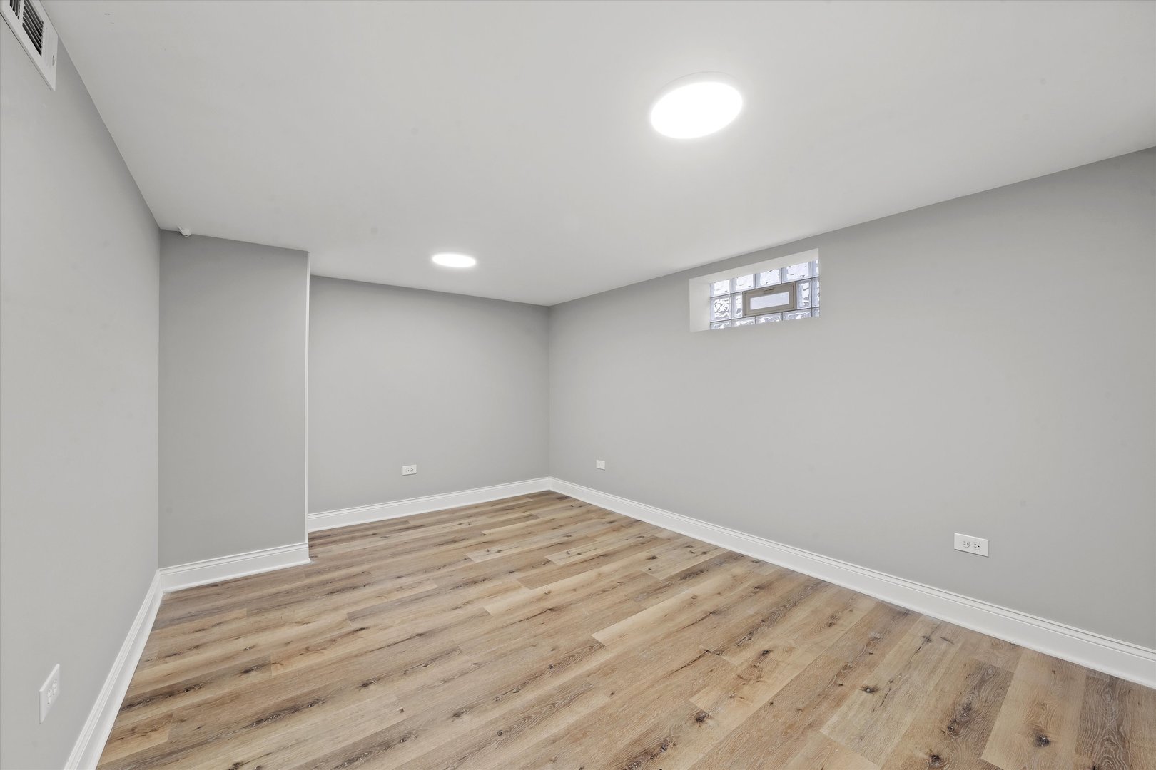 10344 South State Street Chicago, IL 60628 - Photo 19 of 30 a view of empty room with wooden floor