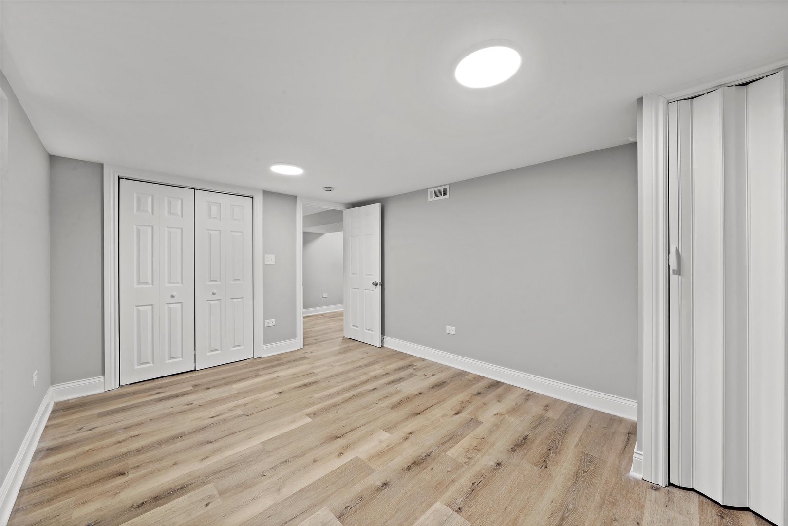 10344 South State Street Chicago, IL 60628 - Photo 20 of 30 a view of an empty room with wooden floor