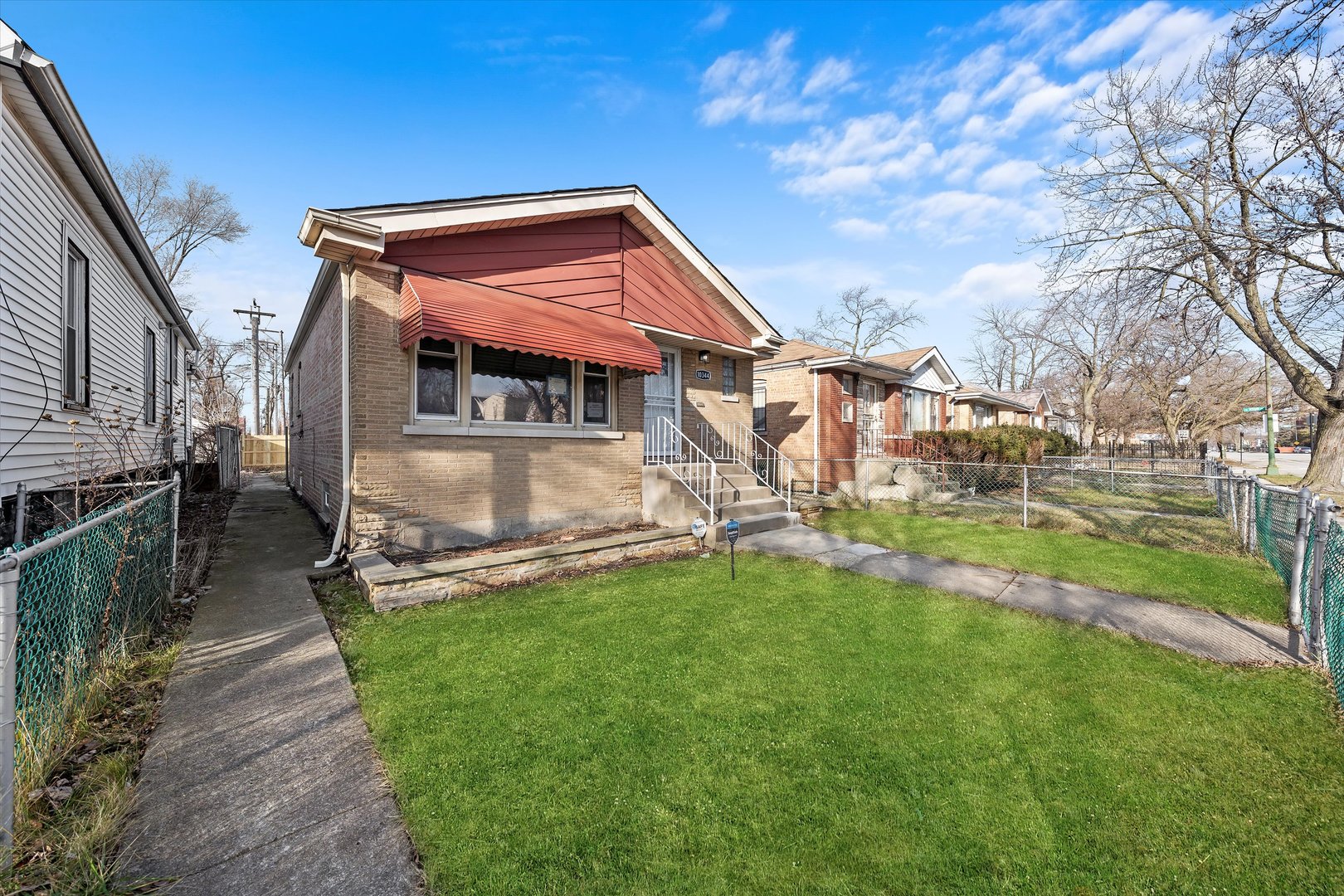 10344 South State Street Chicago, IL 60628 - Photo 2 of 30 a view of a house with a yard porch and sitting area