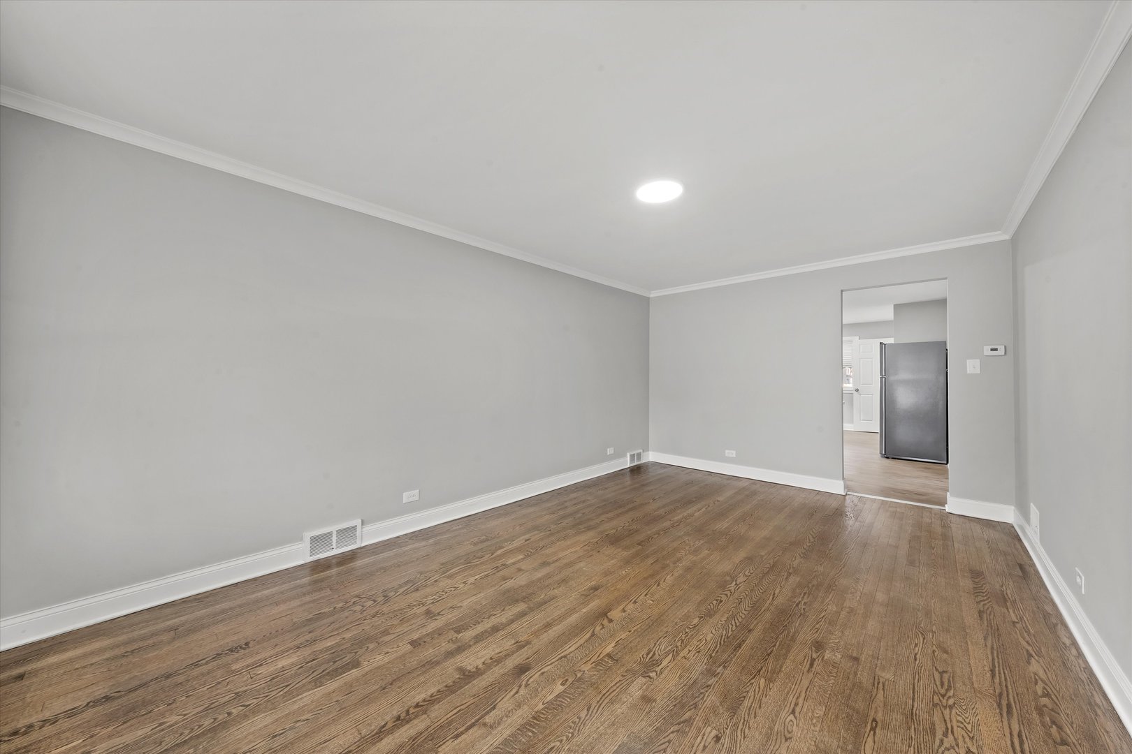 10344 South State Street Chicago, IL 60628 - Photo 25 of 30 a view of an empty room with wooden floor and closet