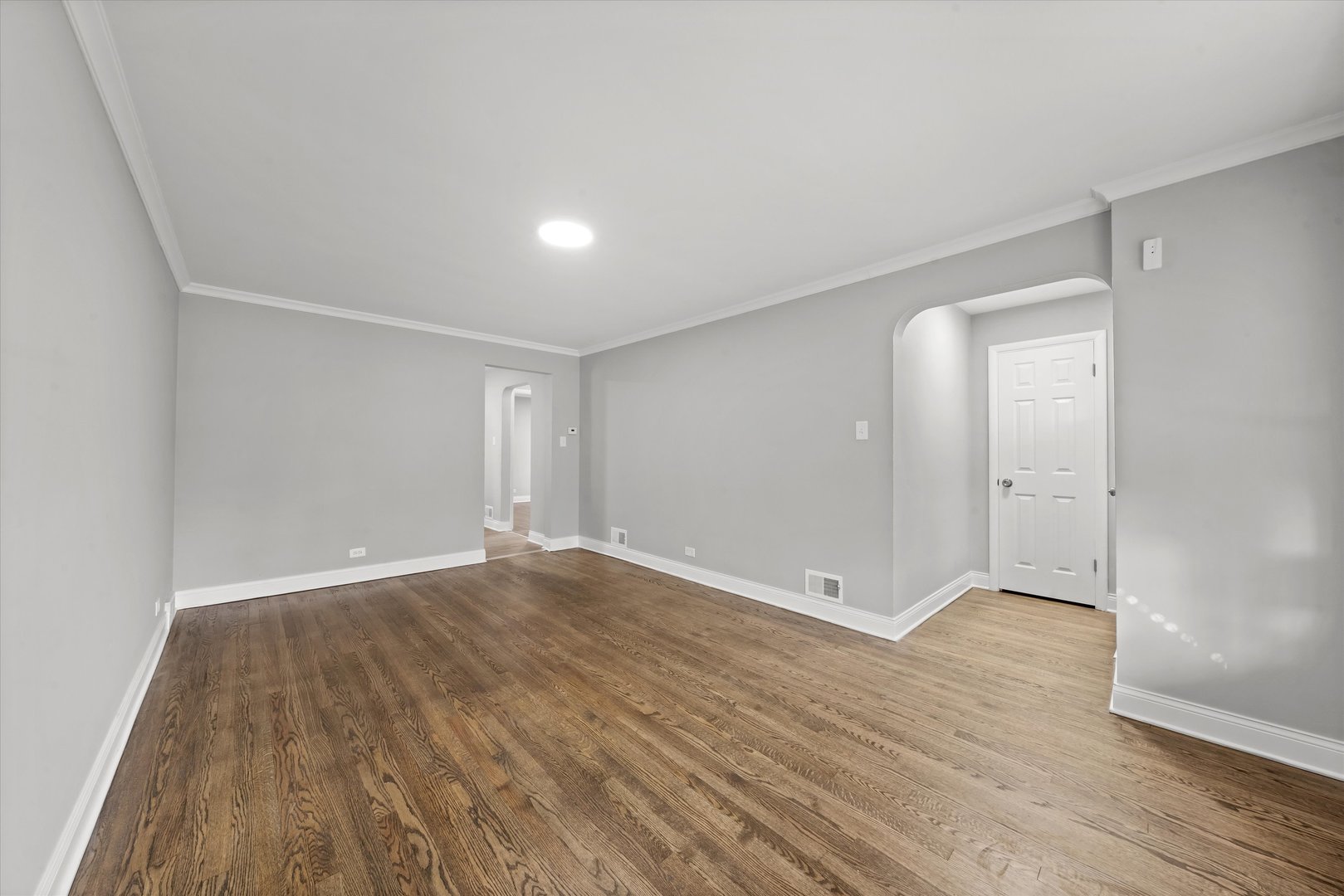 10344 South State Street Chicago, IL 60628 - Photo 26 of 30 a view of an empty room with wooden floor