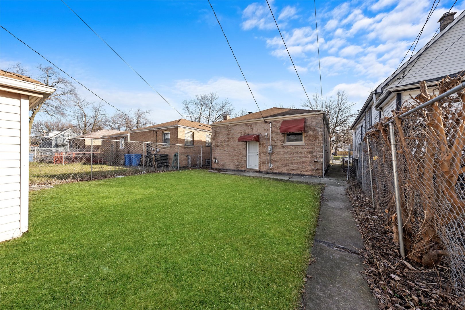 10344 South State Street Chicago, IL 60628 - Photo 29 of 30 a front view of a house with garden