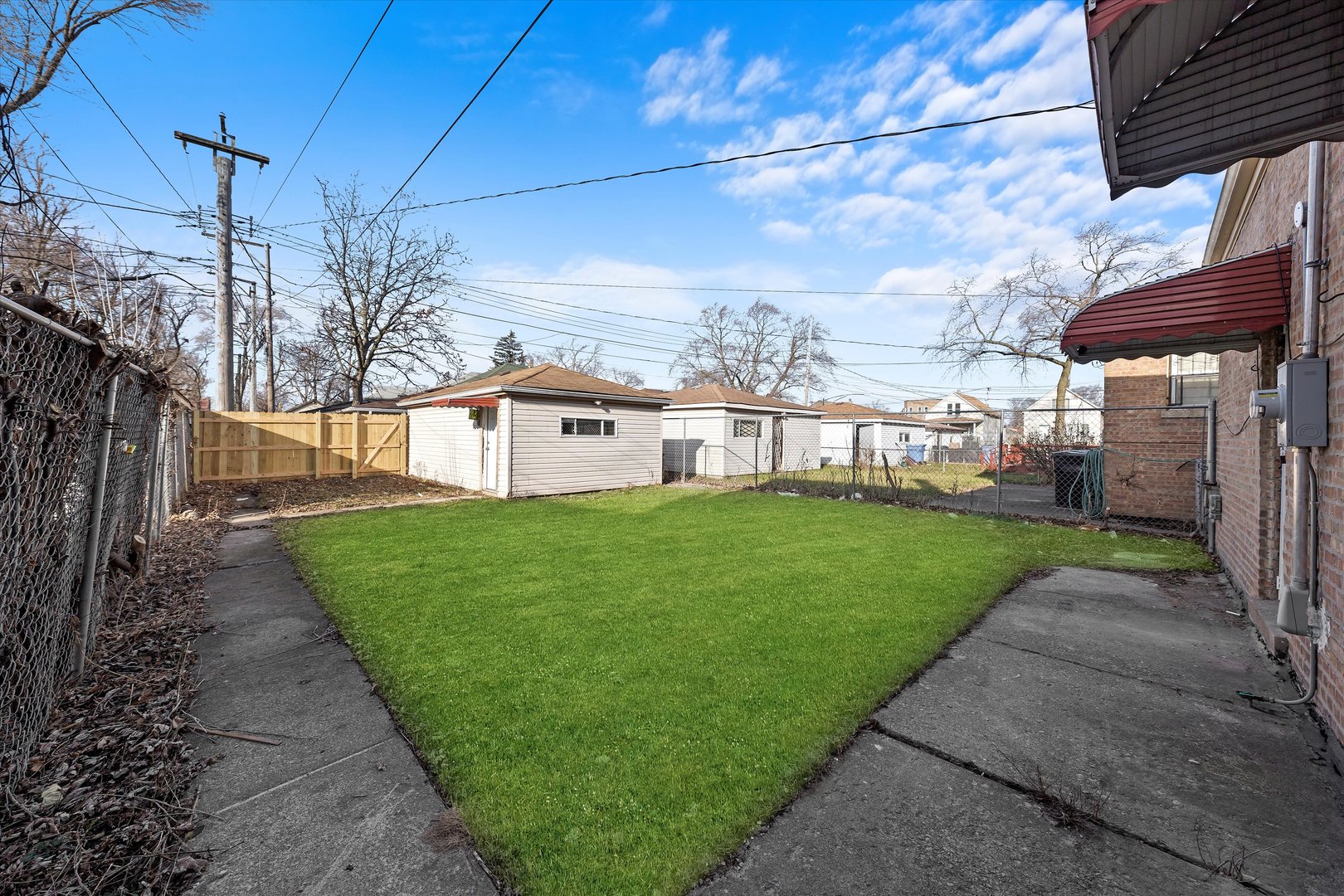 10344 South State Street Chicago, IL 60628 - Photo 30 of 30 a view of a house with a yard