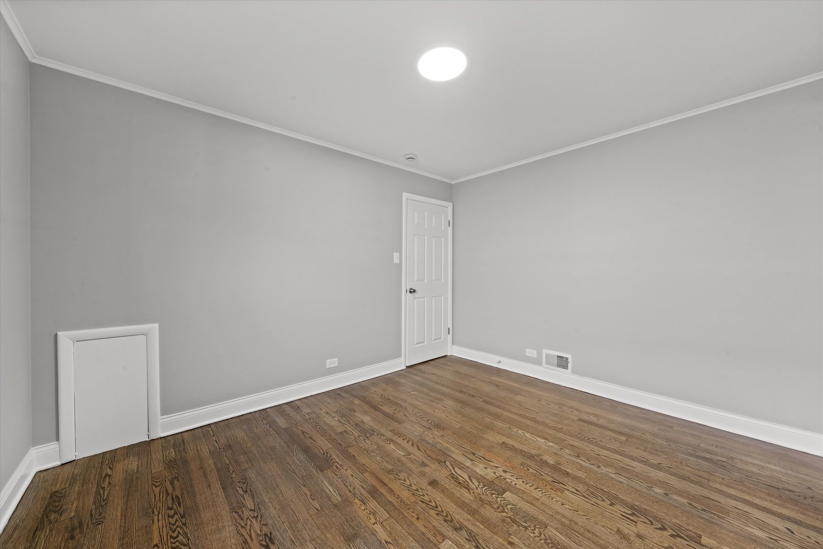 10344 South State Street Chicago, IL 60628 - Photo 8 of 30 a view of room with wooden floor