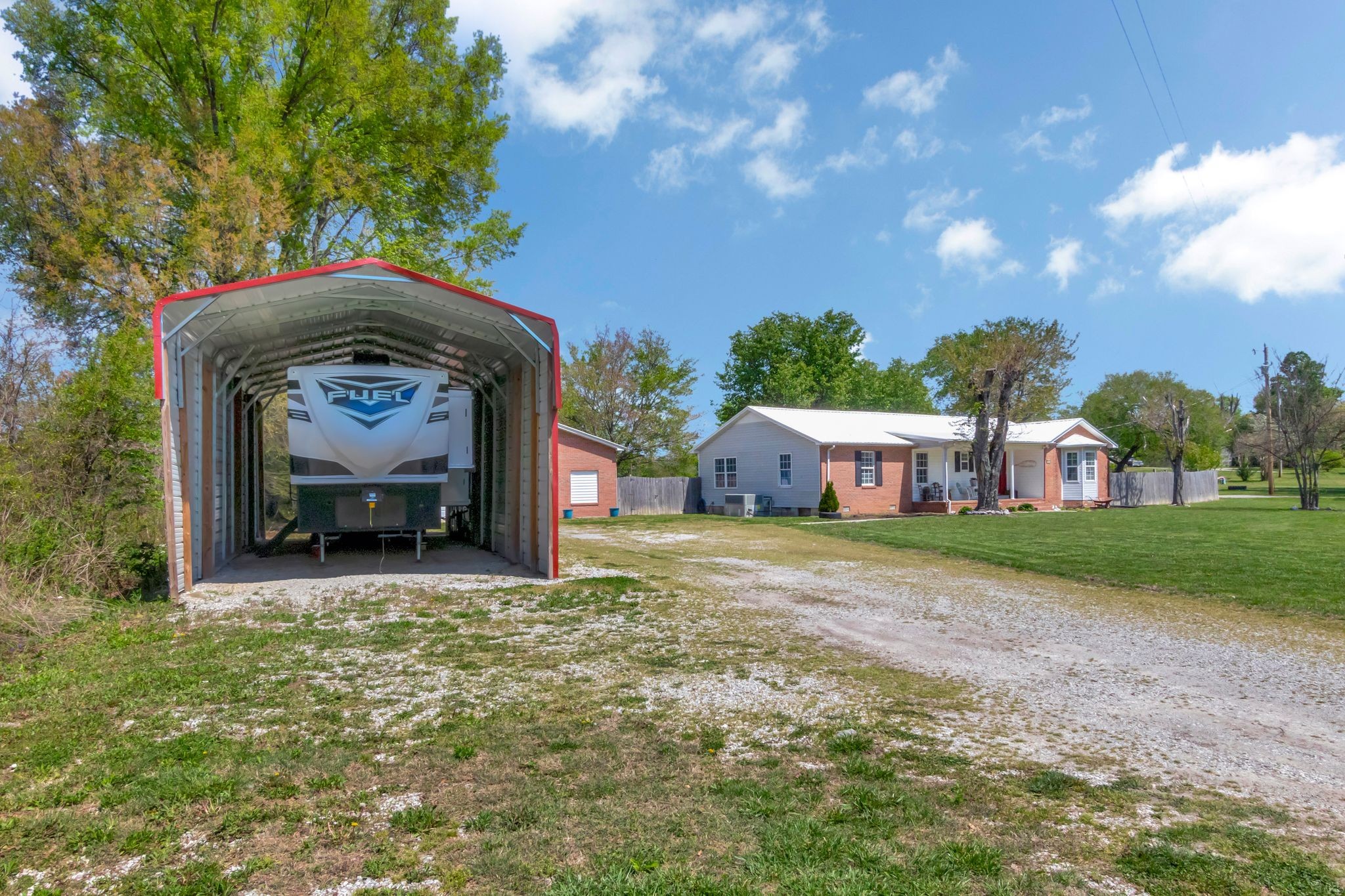 2643 Monroe Floyd Road Decherd, TN 37324 - Photo 5 of 42 a front view of a house with a yard and garage