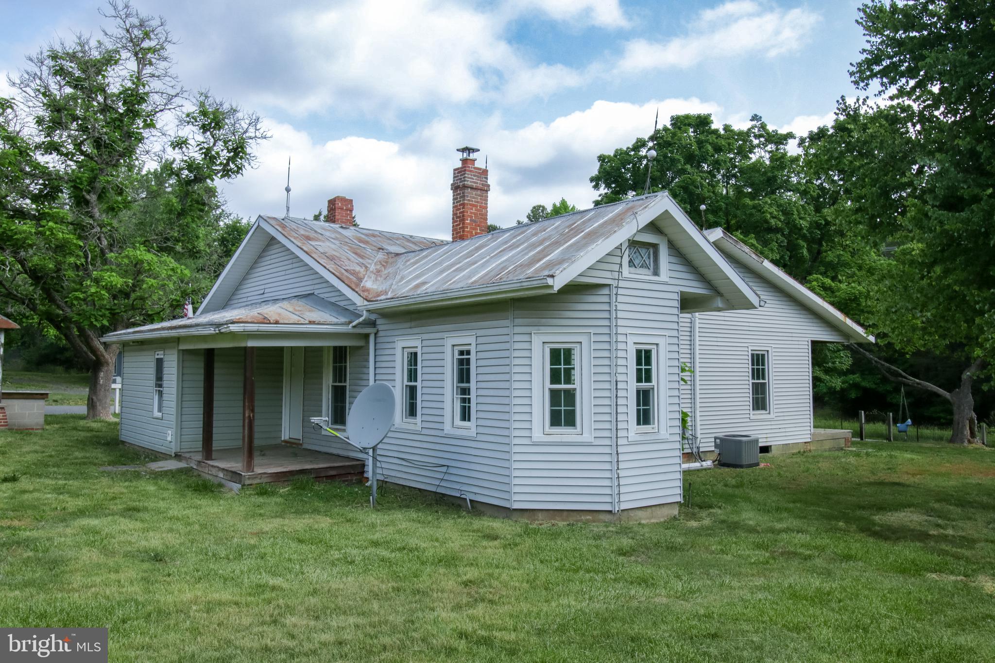 198 Mt Hope Church Road Bumpass, VA 23024 - Photo 4 of 25 a view of a house with a backyard