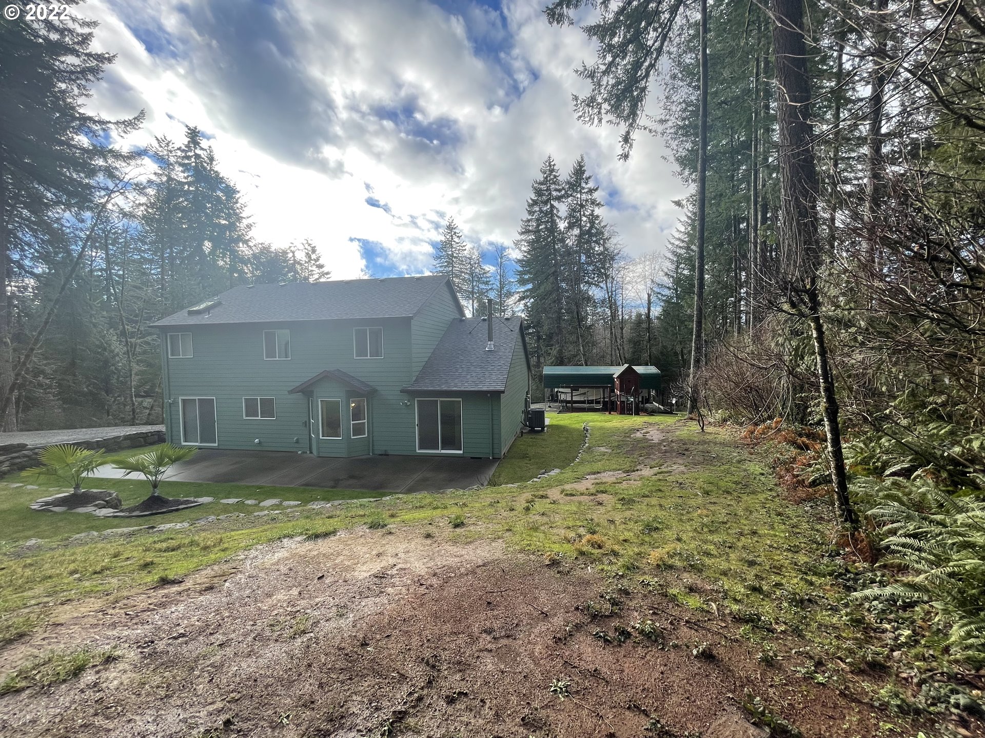 23688 Southeast Firwood Road Sandy, OR 97055 - Photo 3 of 31 a view of a house with a yard