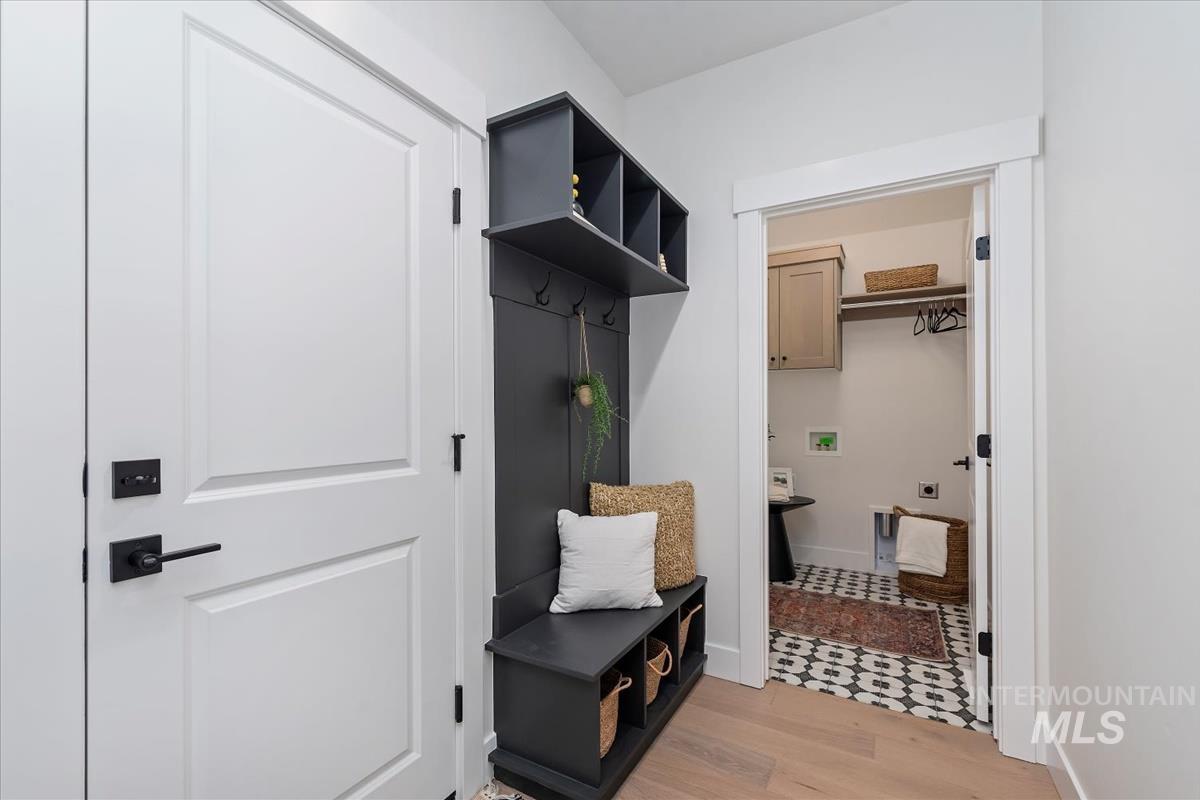 2242 East Rodeo Street Kuna, ID 83634 - Photo 17 of 37 Mudroom featuring light wood-style floors and baseboards