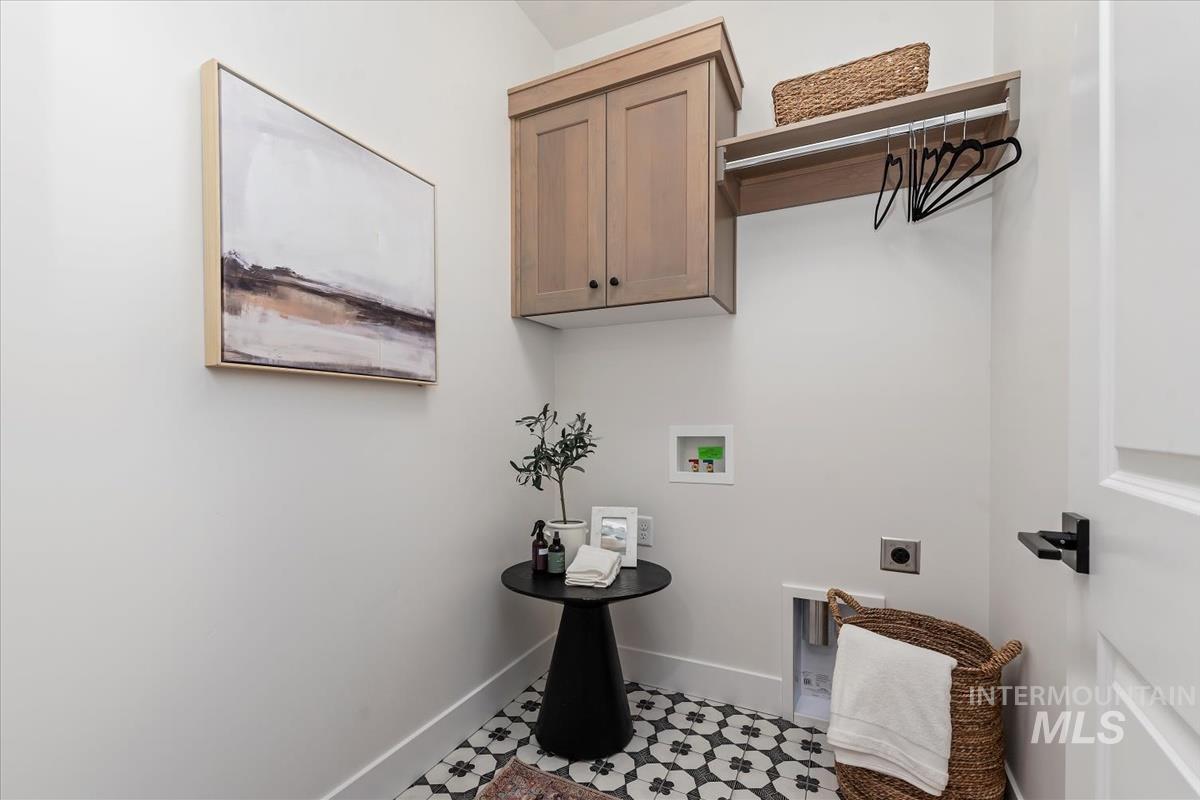 2242 East Rodeo Street Kuna, ID 83634 - Photo 18 of 37 Laundry area featuring electric dryer hookup, washer hookup, and cabinet space