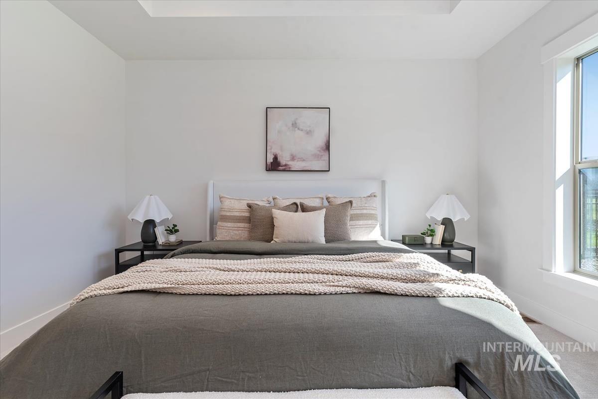 2242 East Rodeo Street Kuna, ID 83634 - Photo 25 of 37 Bedroom featuring carpet and multiple windows