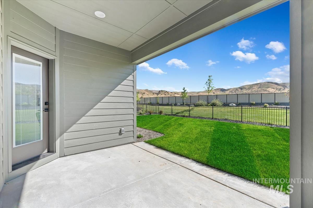 2242 East Rodeo Street Kuna, ID 83634 - Photo 31 of 37 Fenced backyard featuring a patio and a mountain view