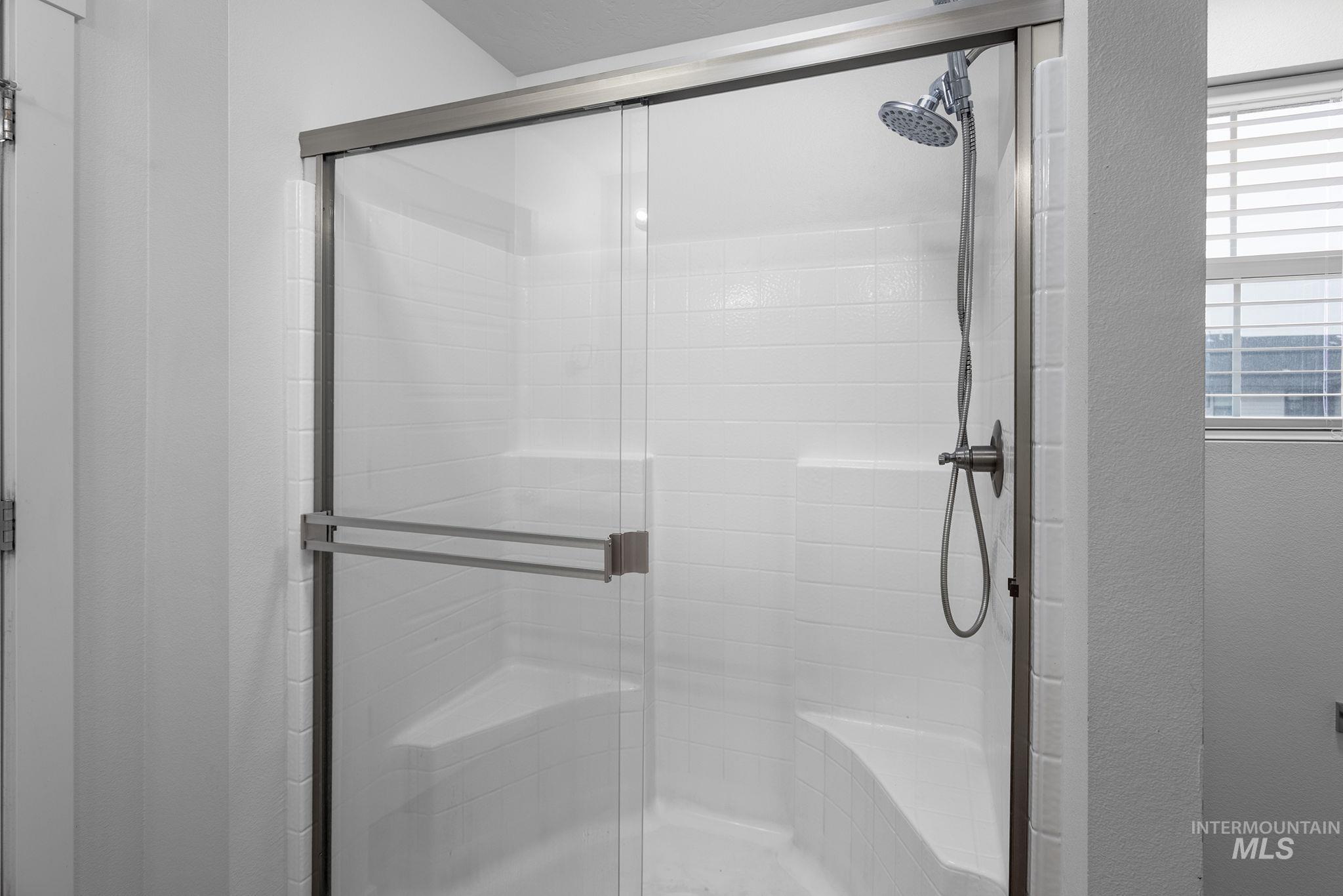 262 South Riggs Spg Avenue Meridian, ID 83642 - Photo 21 of 25 Full bath with a shower stall and a textured wall