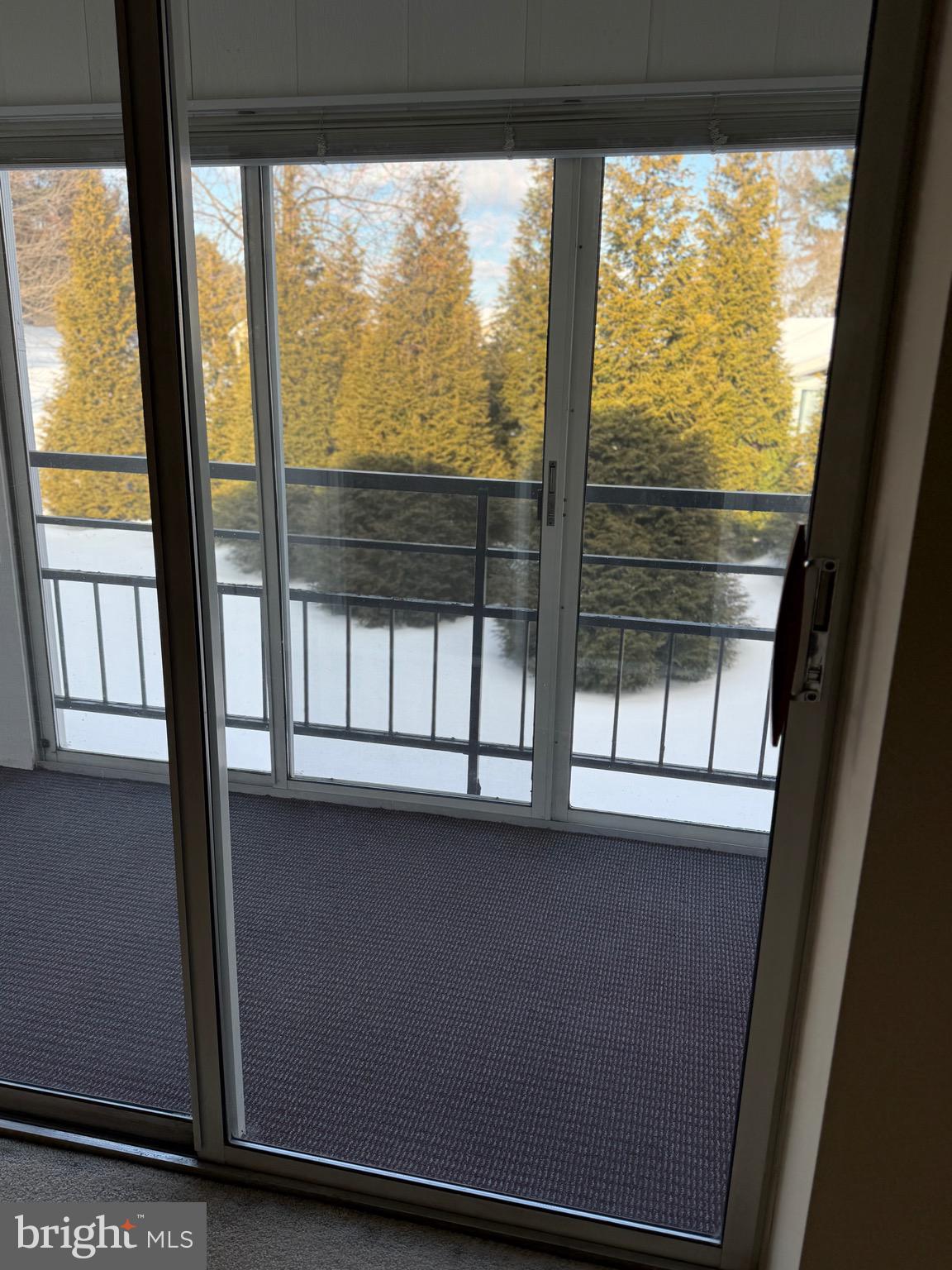 15401 Bassett Lane, Unit 452E Silver Spring, MD 20906 - Photo 12 of 31 a view of an empty room with a window