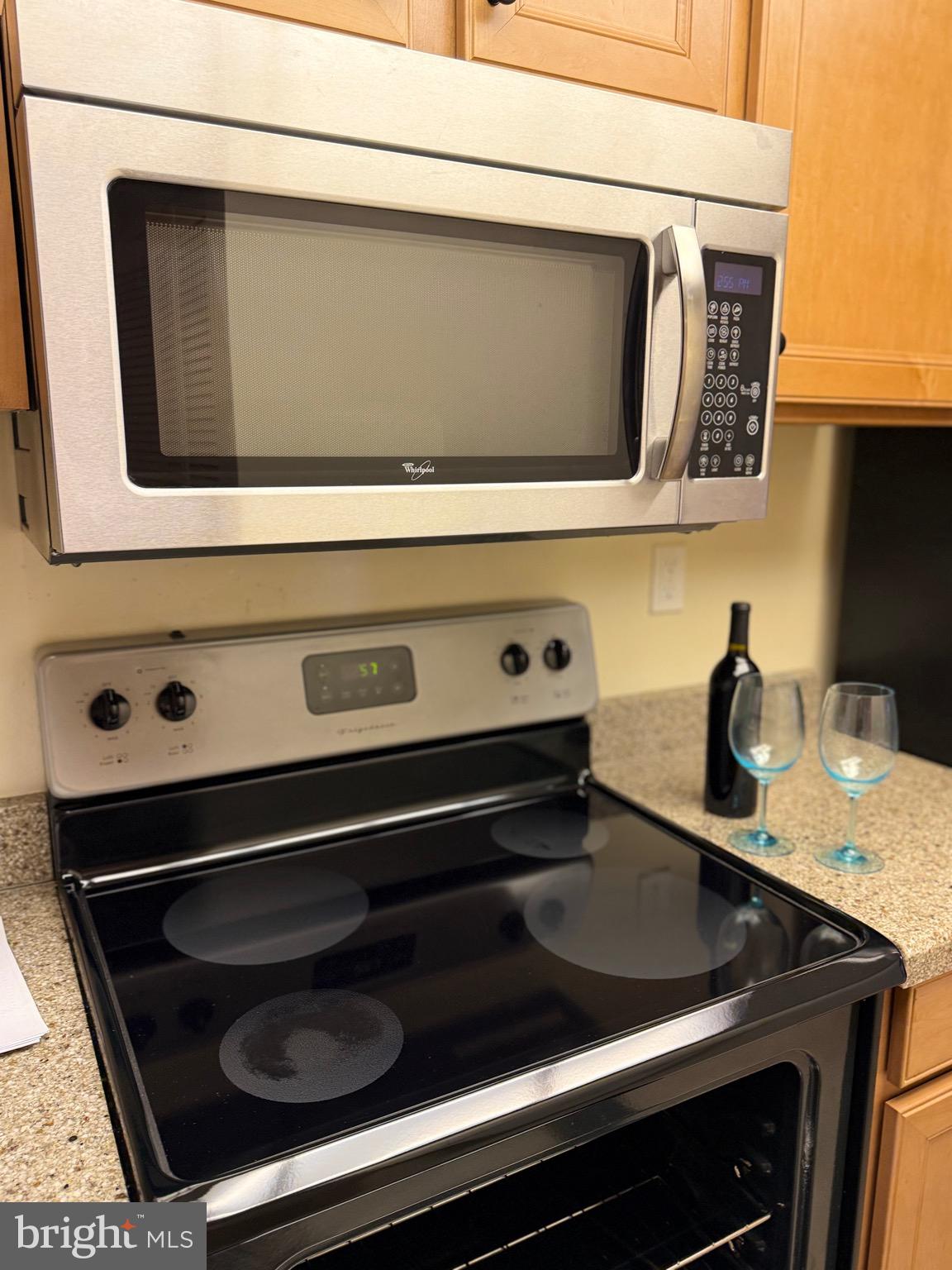 15401 Bassett Lane, Unit 452E Silver Spring, MD 20906 - Photo 16 of 31 a kitchen with a stove and a microwave